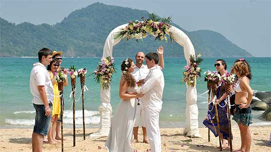 Pictures of people getting married on a beach